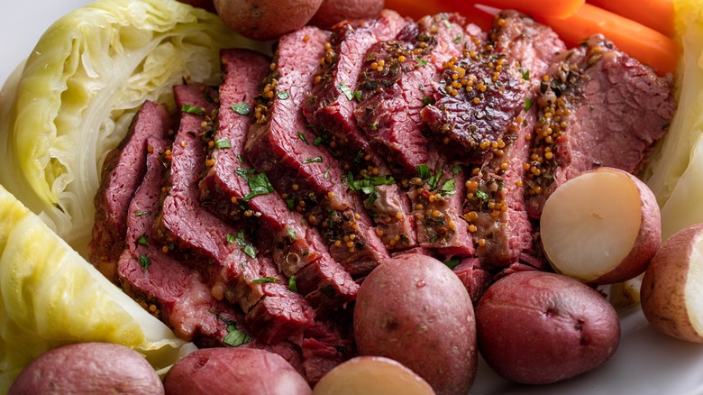 Sliced corned beef among veggies