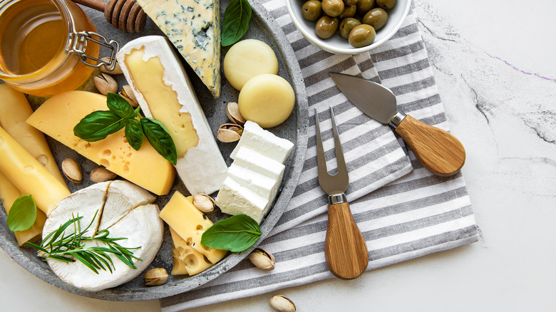 Cheese board with knives