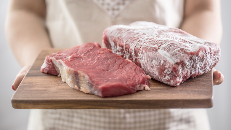 A tray with frozen and unfrozen steak