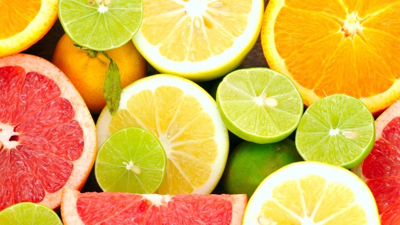Acidic citrus fruits cut in half