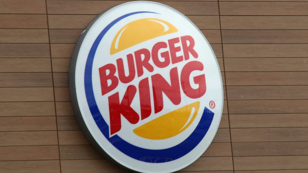 Burger King sign on wooden background