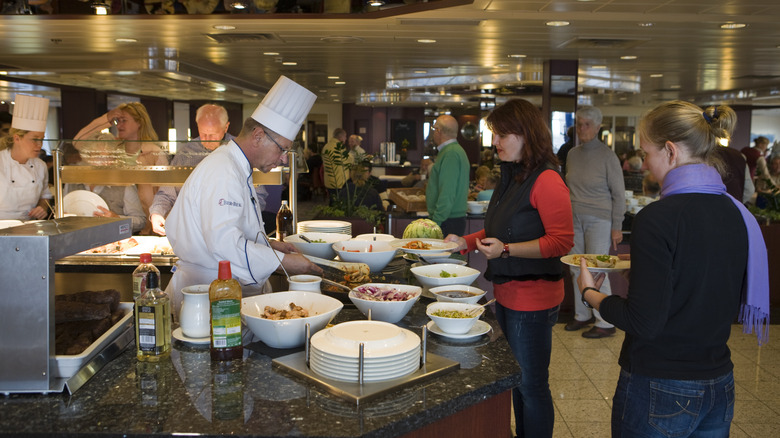 Chef preparing food at buffet