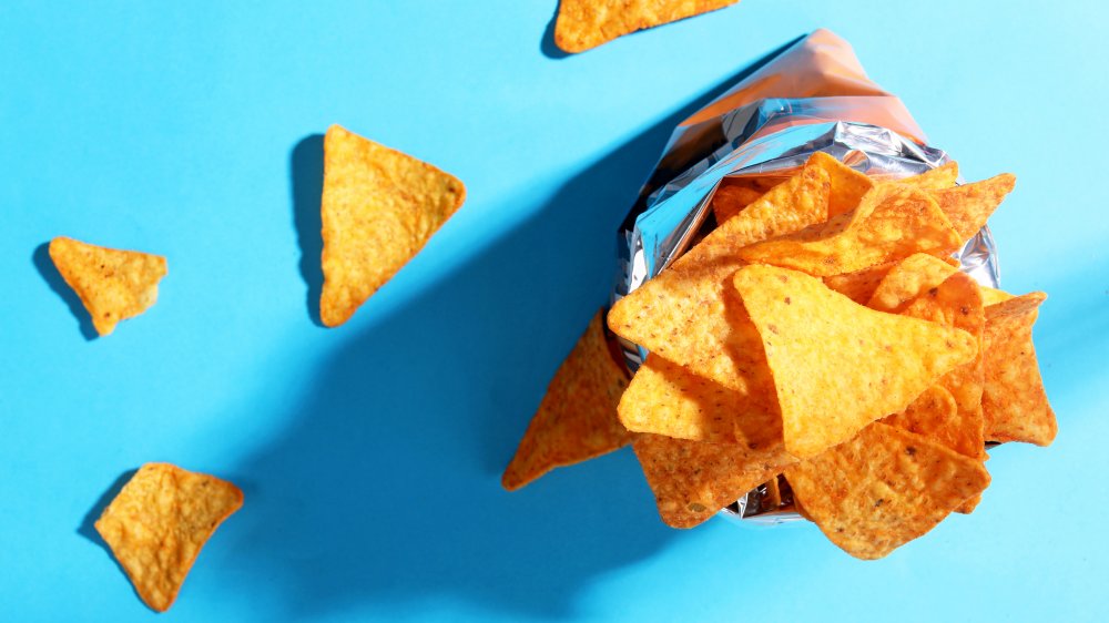 bag of potato chips on blue background