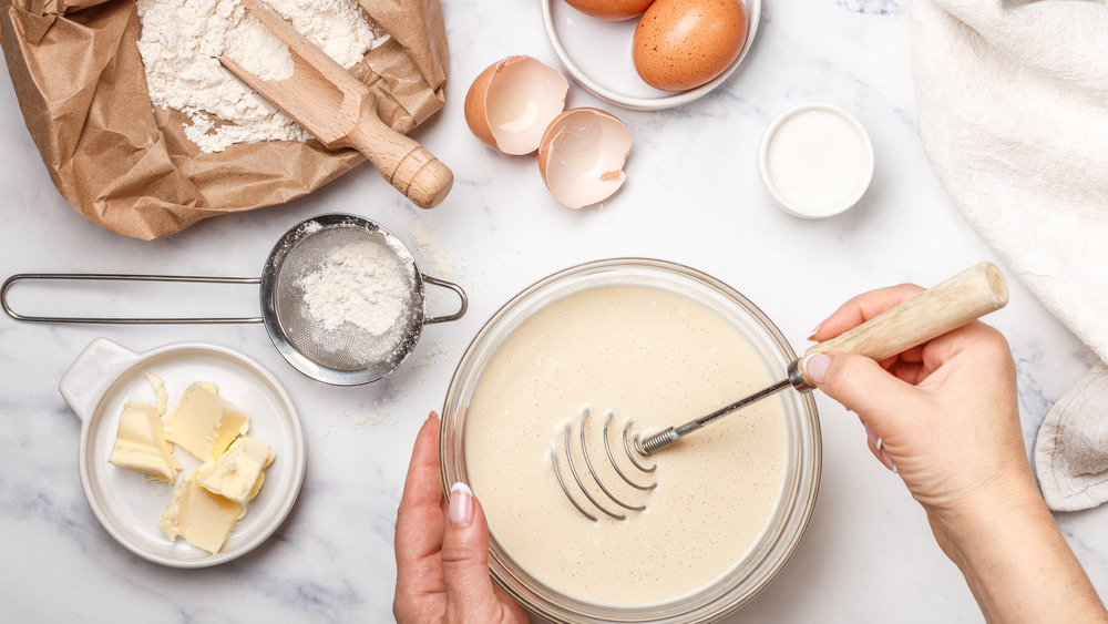 Person mixing pancake batter