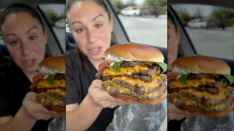 Content creator HellthyJunkFood holding up Wendy's meat cube burger