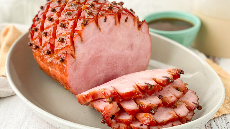 cooked ham on white plate