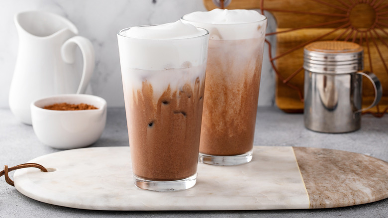 Two beverages with cold foam on counter