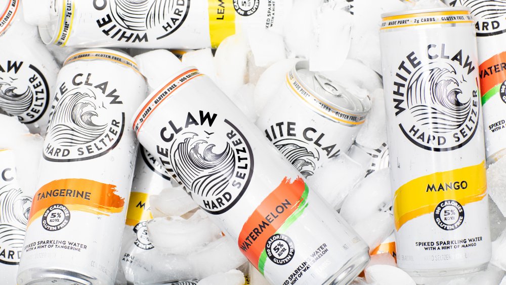 Cans of White Claw hard seltzer on ice