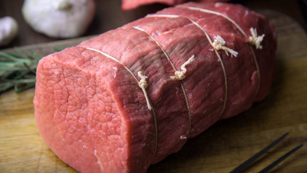 Eye of round roast on cutting board