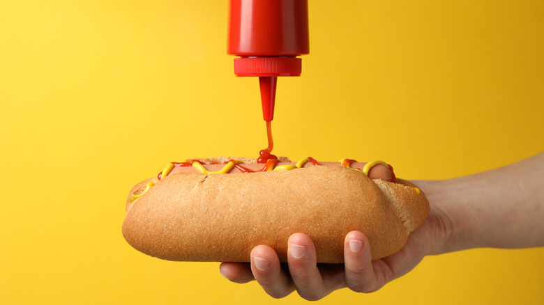 Ketchup atop a hot dog 