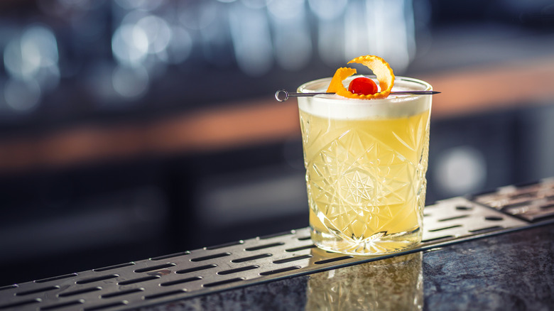 A whiskey sour on bar