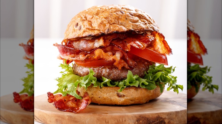 BLT hamburger on cutting board