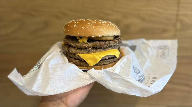 Hand holding Quad Stacker in wrapper