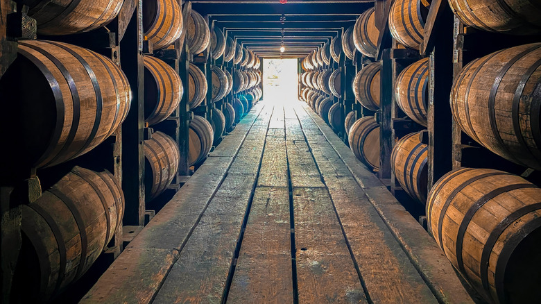 Stacks of bourbon barrels aging