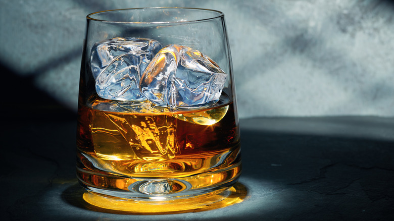 Glass of bourbon on ice