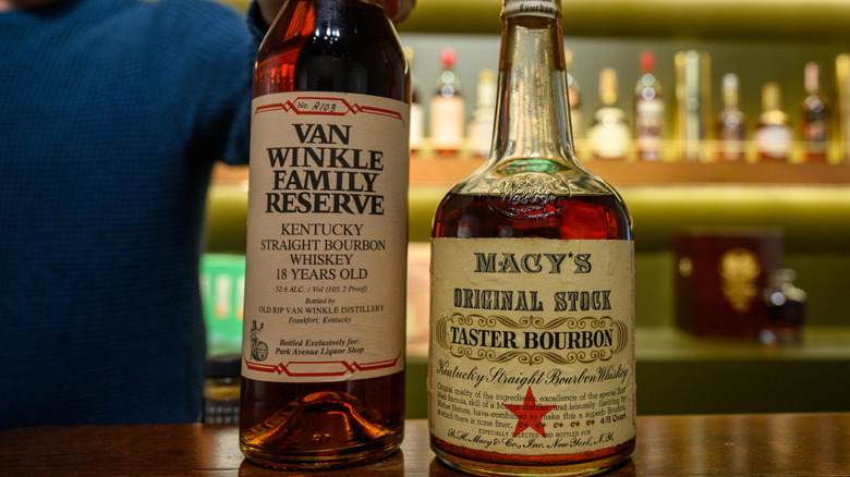 Two bottles of bourbon on bar, one displays proof of 105.2