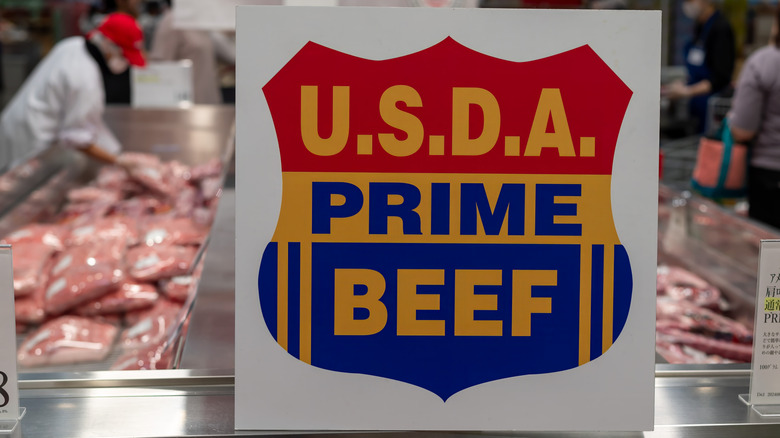 Colorful signage in meat department reading, "USDA Prime beef"