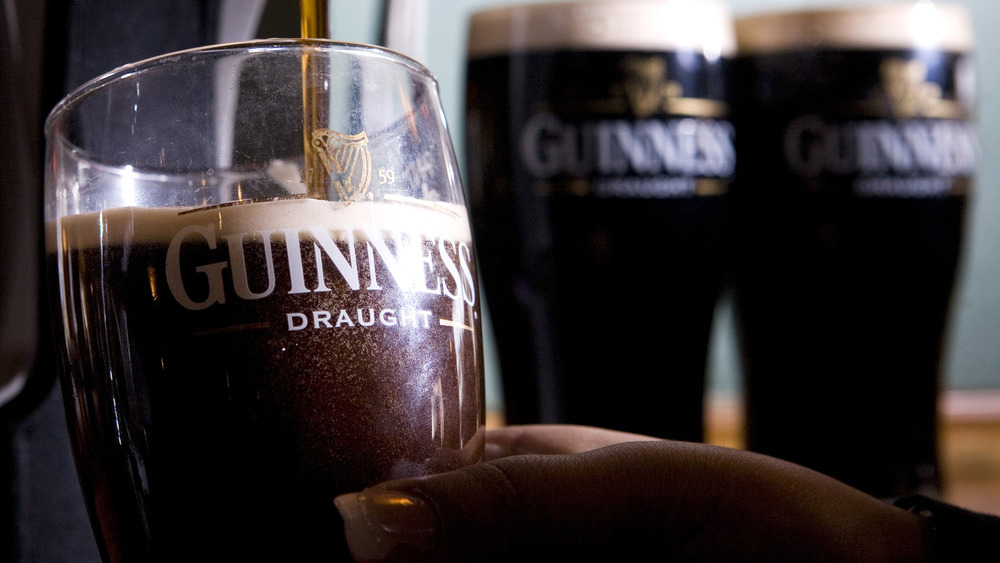 Guinness pours from a tap