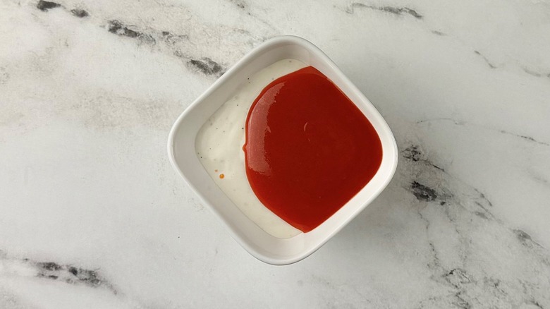 Ranch and hot sauce in bowl