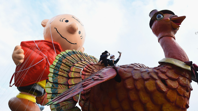 Charlie Brown and turkey parade balloons