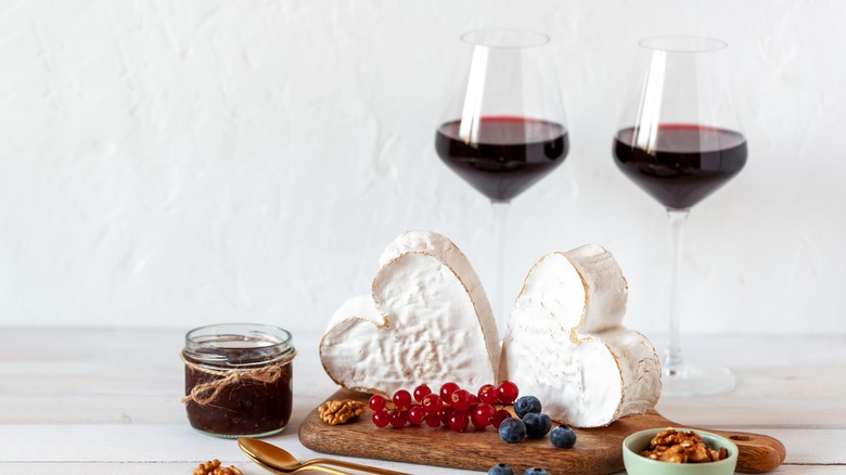 Heart-shaped cheeses with wine glasses 