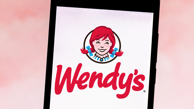 The Wendy's logo on a cell phone.