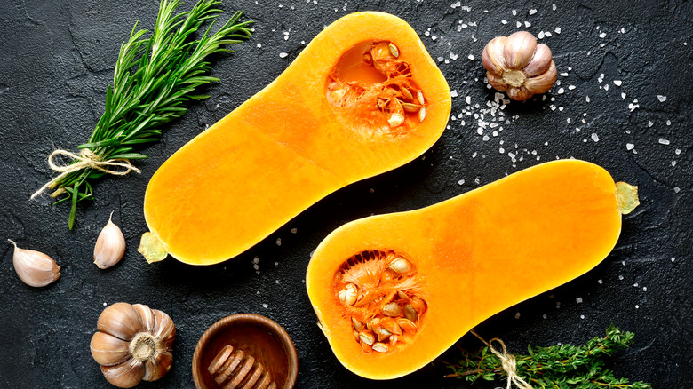 Halved butternut squash with spices
