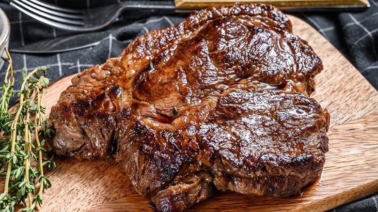 beef chuck cooked on a wooden cutting board