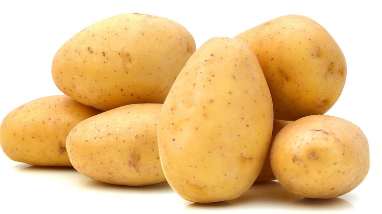 Pile of unpeeled potatoes