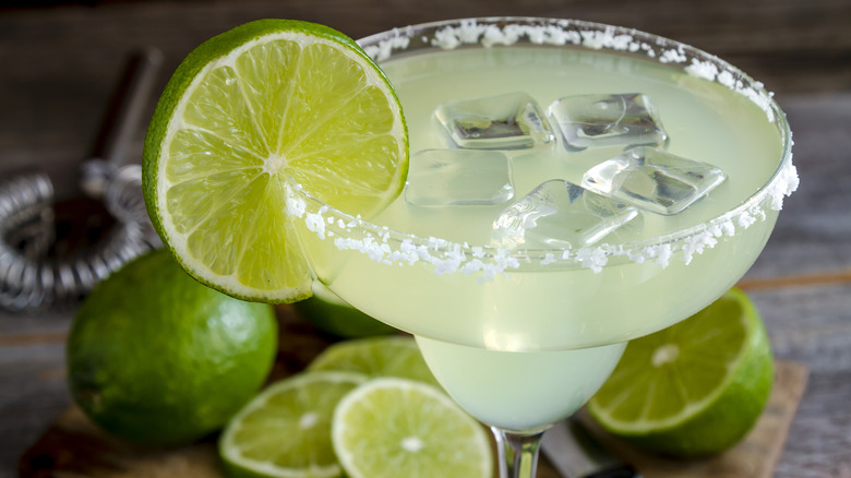 icy margarita with lime garnish and salt