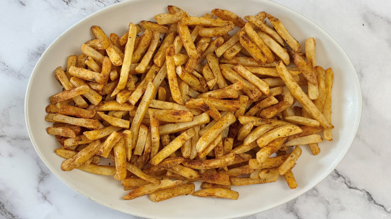 fries on an oval white plate