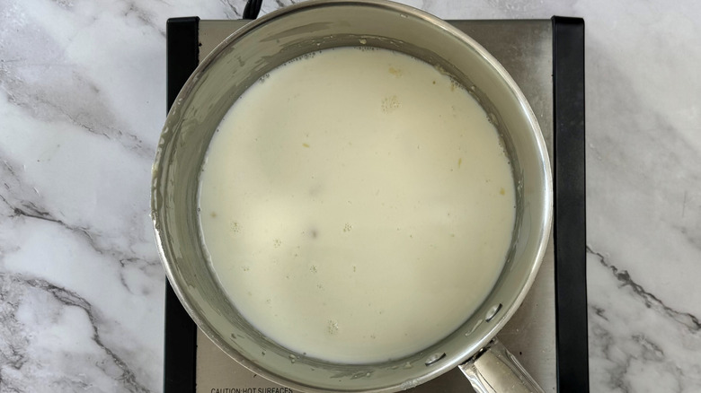 milk in a metal pot