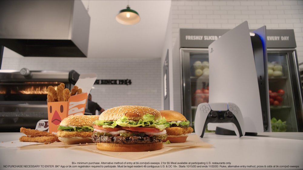 Burger King menu items next to a Sony PlayStation 5