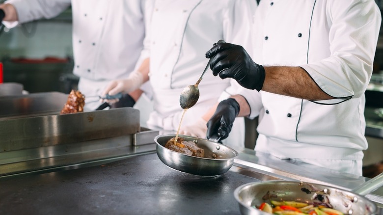 Line cook in white chef uniform