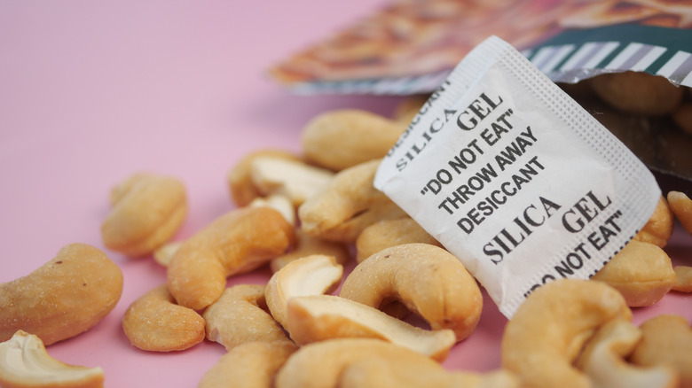 Silica gel packet among cashews