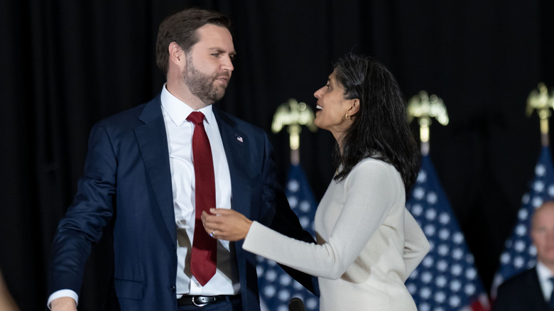 JD and Usha Vance on stage at a campaign event in 2024