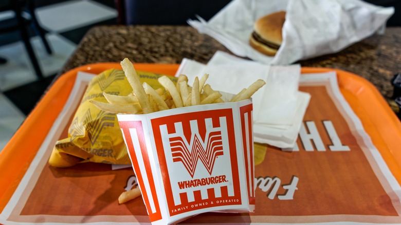 Whataburger burger and fries on a tray