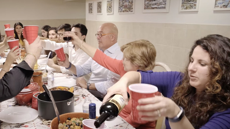 Screenshot of Andrew Zimmern at table on "Family Dinner"