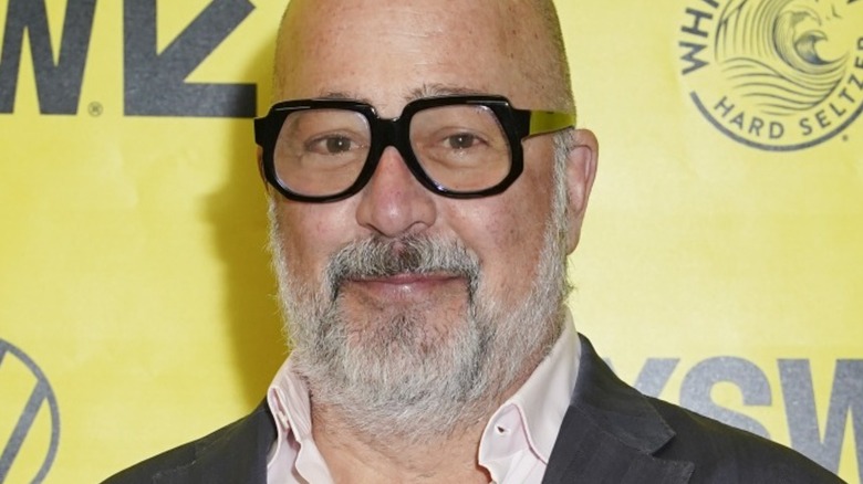 Andrew Zimmern in black-rimmed glasses