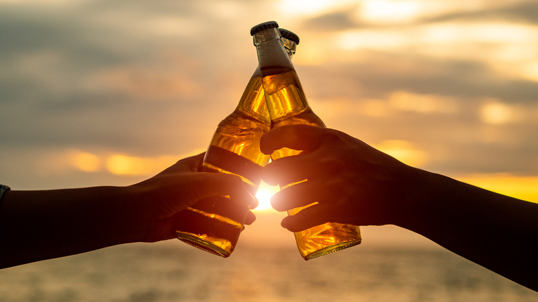 beer toast on beach