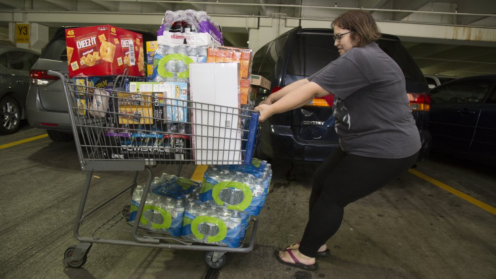 Sam's Club shopper with bulk packaged food