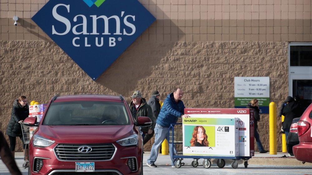 Man buying new TVs from Sam's Club