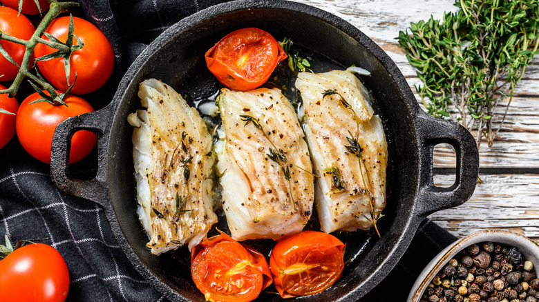 Fish and tomatoes in cast iron