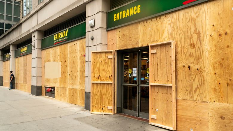 grocery store storefront boarded up