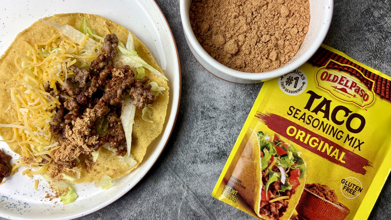 Old El Paso Original Taco Seasoning Mix packet, seasoning in a white ramekin, and taco on a white plate