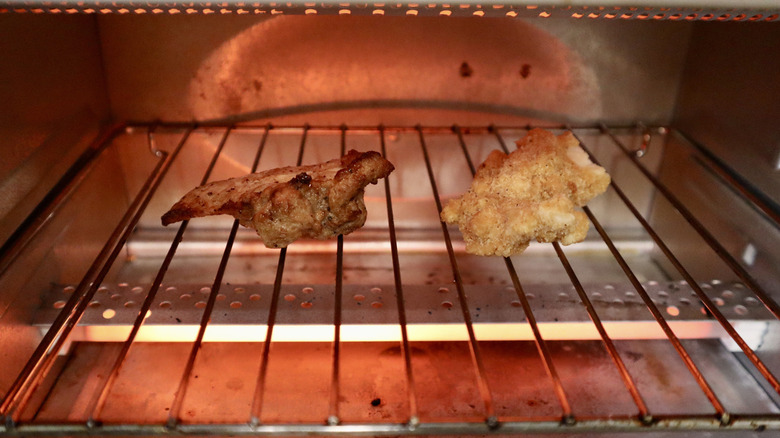 two chicken tenders in a toaster oven