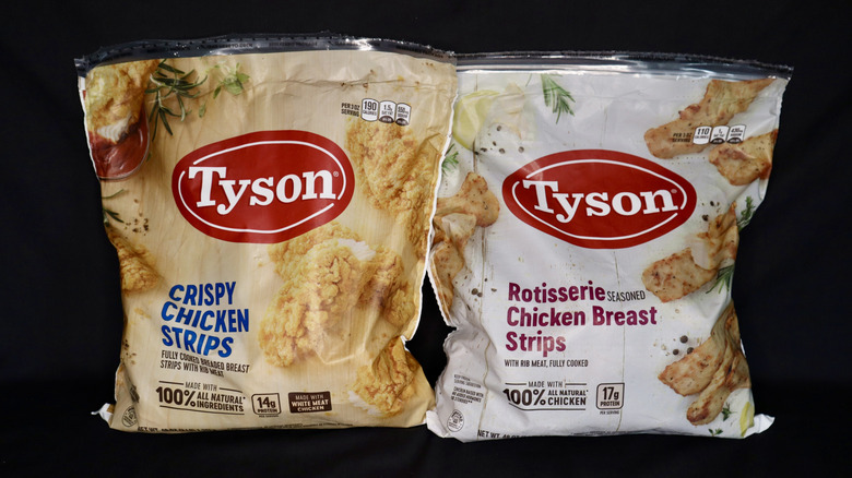 two bags of Tyson Chicken Tenders on black background