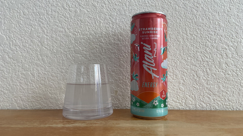 Strawberry Sunrise can beside some poured into a small glass