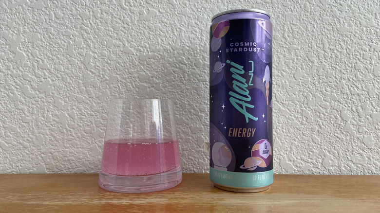 Cosmic Stardust can beside some poured into a small glass