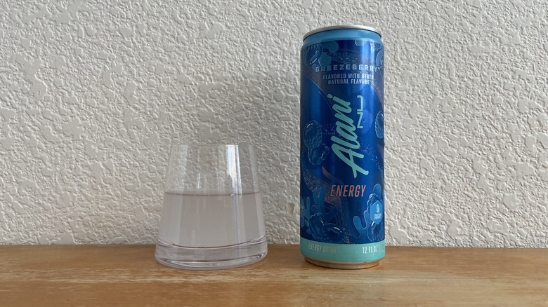 Breezeberry can beside some poured into a small glass